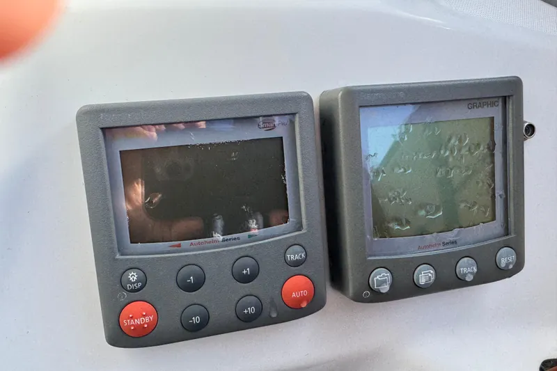 Wakadui Yacht Photos Pics Autopilot and graphic displays on a 2009 Beneteau 49 yacht dashboard.