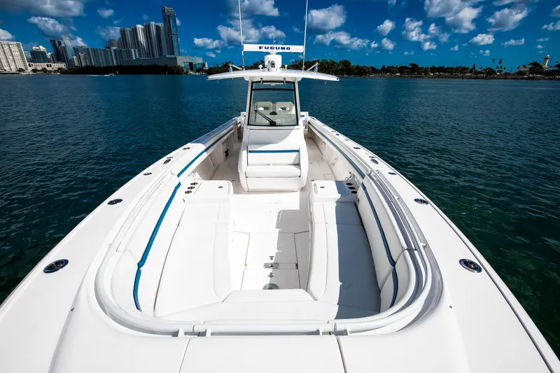  Yacht Photos Pics 2017 Intrepid 375 Center Console boat on water with city skyline background.