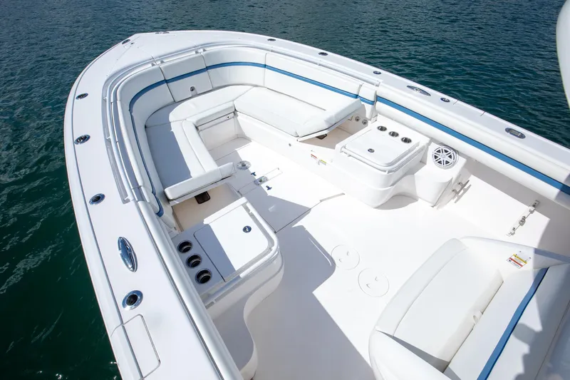  Yacht Photos Pics 2017 Intrepid 375 Center Console boat with spacious seating and sleek design on water.