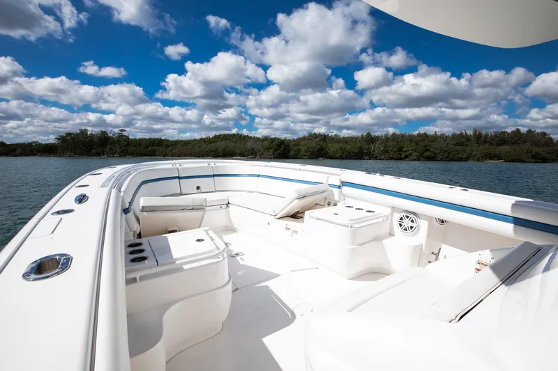  Yacht Photos Pics 2017 Intrepid 375 Center Console boat with spacious seating, under a vibrant blue sky.