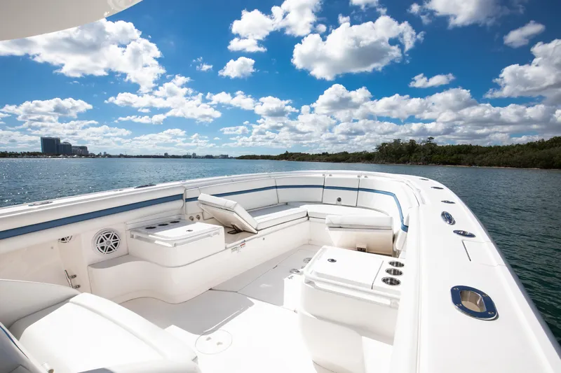  Yacht Photos Pics 2017 Intrepid 375 Center Console boat on calm water under a blue sky with clouds.