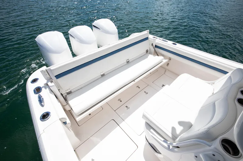  Yacht Photos Pics 2017 Intrepid 375 Center Console boat with white seating and triple engines on water.