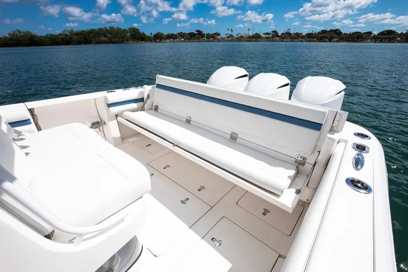  Yacht Photos Pics 2017 Intrepid 375 Center Console boat with seating, on a sunny day by the water.