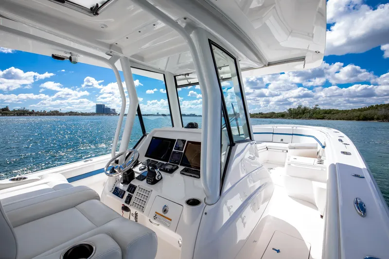  Yacht Photos Pics 2017 Intrepid 375 Center Console boat on a sunny day, featuring sleek design and modern controls.