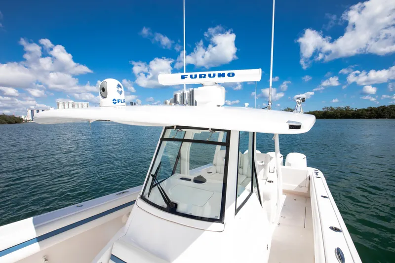  Yacht Photos Pics 2017 Intrepid 375 Center Console boat on calm water under a clear blue sky.