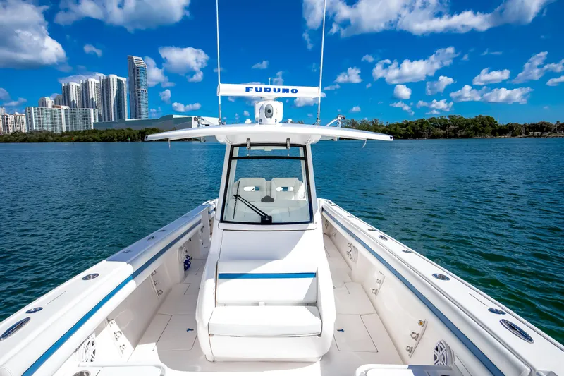 Yacht Photos Pics 2017 Intrepid 375 Center Console boat on water with city skyline background.