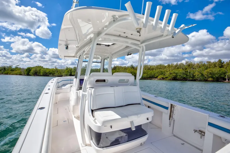  Yacht Photos Pics 2017 Intrepid 375 Center Console boat on calm water under a blue sky.