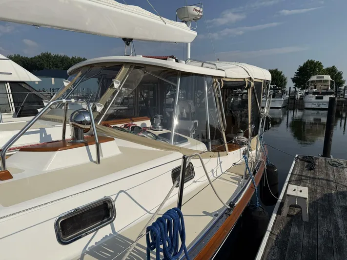 Yacht Photos Pics Sailboat docked at marina, Tartan 4300 model, 2011, with clear skies and calm water.