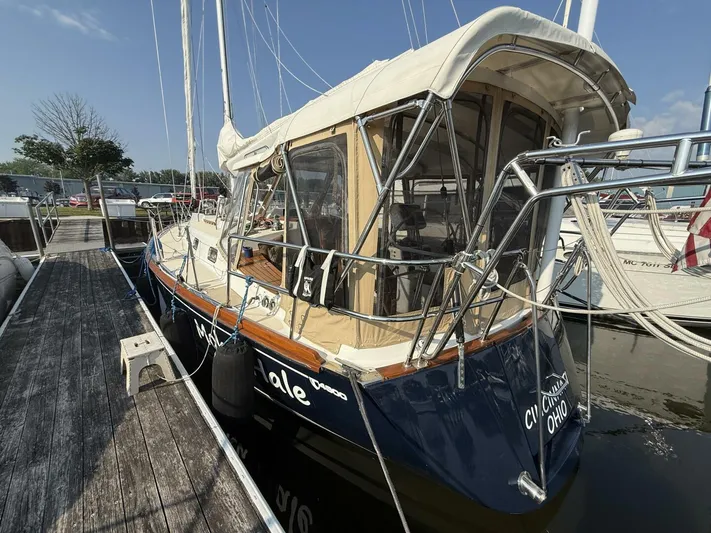  Yacht Photos Pics Sailboat Tartan 4300, 2011 model, docked at marina with canopy and rigging.