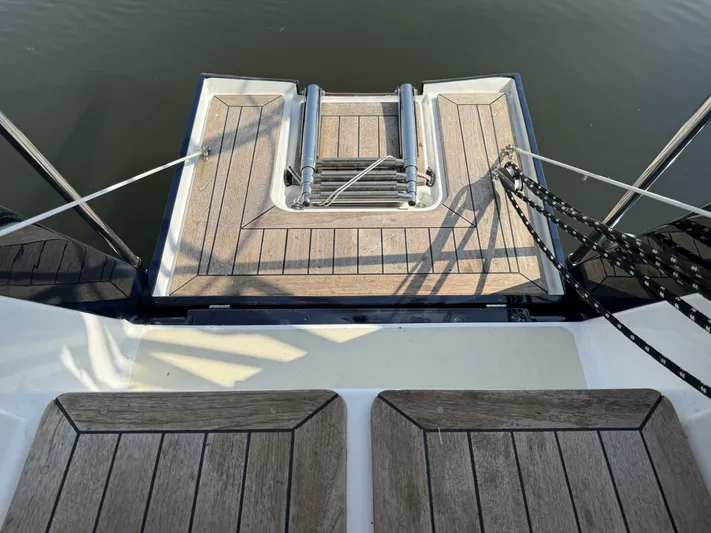  Yacht Photos Pics Stern view of 2011 Tartan 4300 yacht with wooden deck and ladder.