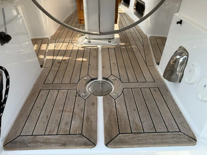  Yacht Photos Pics Teak deck of 2011 Tartan 4300 sailboat, featuring clean lines and polished metal accents.