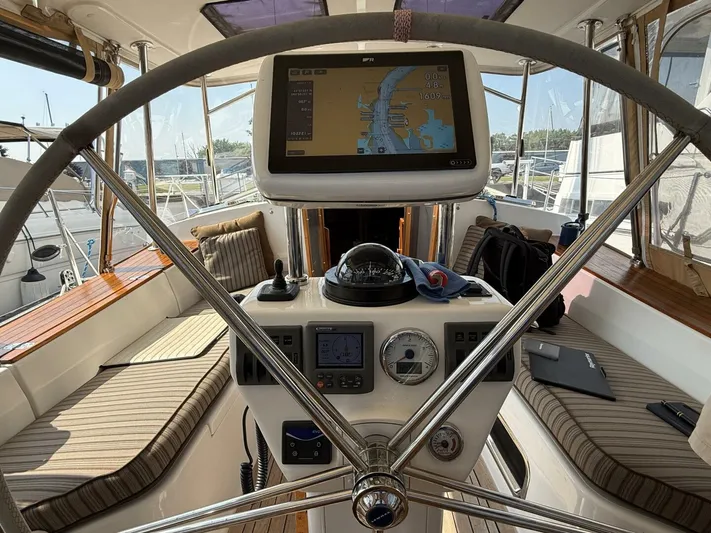  Yacht Photos Pics Steering wheel and navigation system on a 2011 Tartan 4300 sailboat.