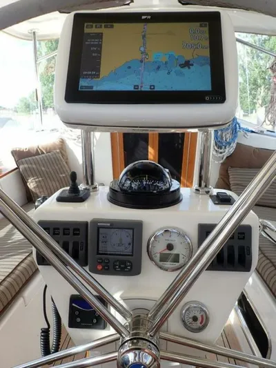  Yacht Photos Pics Cockpit of 2011 Tartan 4300 sailboat with navigation equipment and compass.
