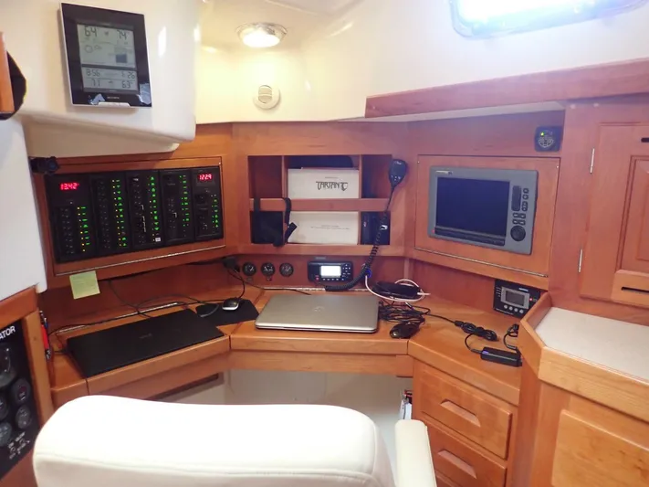  Yacht Photos Pics Navigation station in a 2011 Tartan 4300 yacht with control panels and electronics.