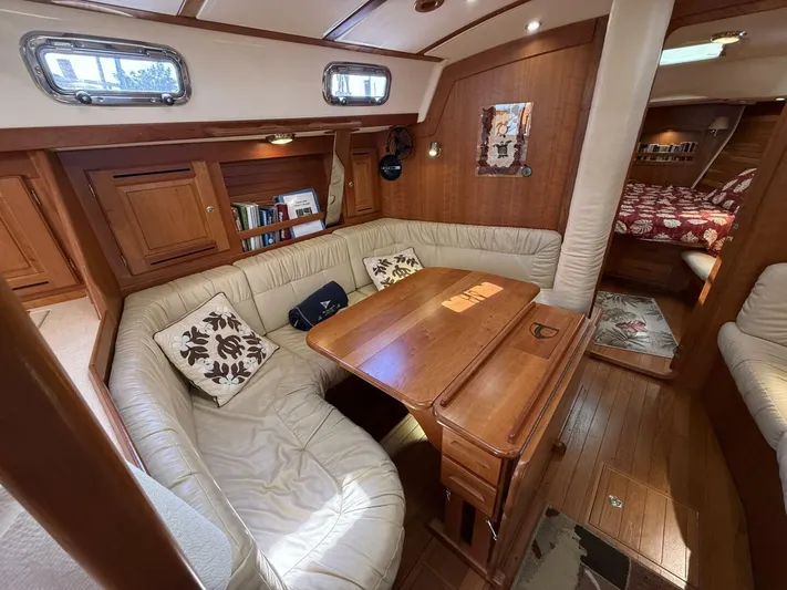  Yacht Photos Pics Luxurious 2011 Tartan 4300 yacht interior with cozy seating and wooden table.