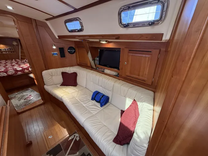  Yacht Photos Pics Luxurious 2011 Tartan 4300 yacht interior with plush seating and elegant wood finish.