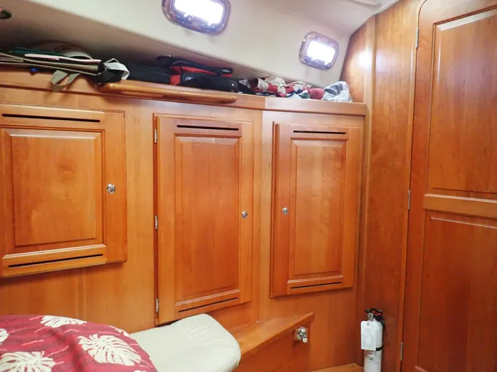  Yacht Photos Pics Wooden interior of 2011 Tartan 4300 yacht cabin with storage cabinets.