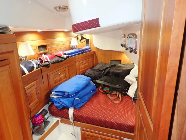  Yacht Photos Pics Cozy cabin interior of 2011 Tartan 4300 yacht with wooden furnishings and storage.
