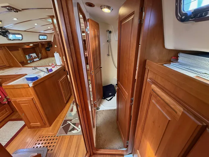  Yacht Photos Pics Interior of 2011 Tartan 4300 yacht with wooden cabinetry and cozy living space.