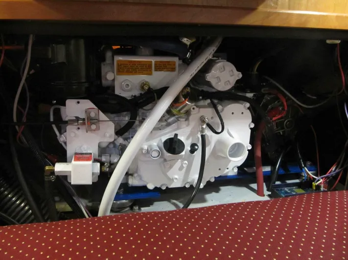  Yacht Photos Pics Engine compartment of a 2011 Tartan 4300 sailboat, showcasing mechanical components and wiring.
