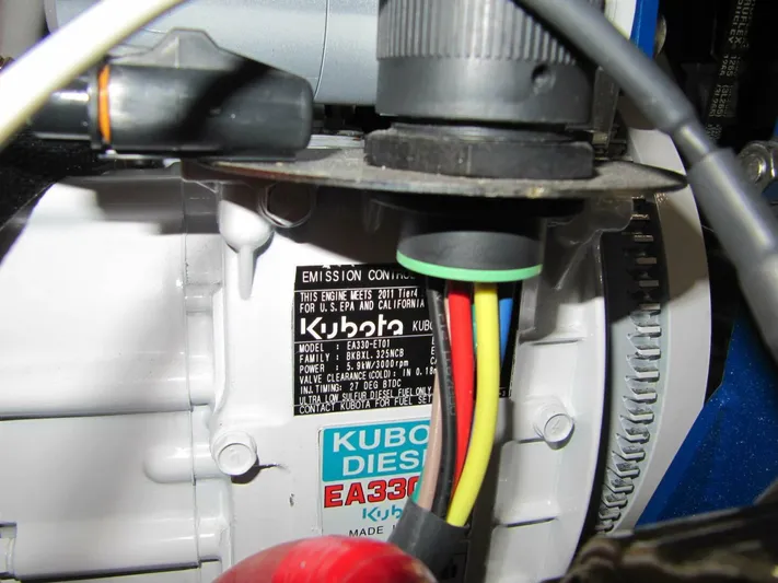  Yacht Photos Pics Close-up of Kubota diesel engine label with colorful wires, Tartan 4300, 2011 model.