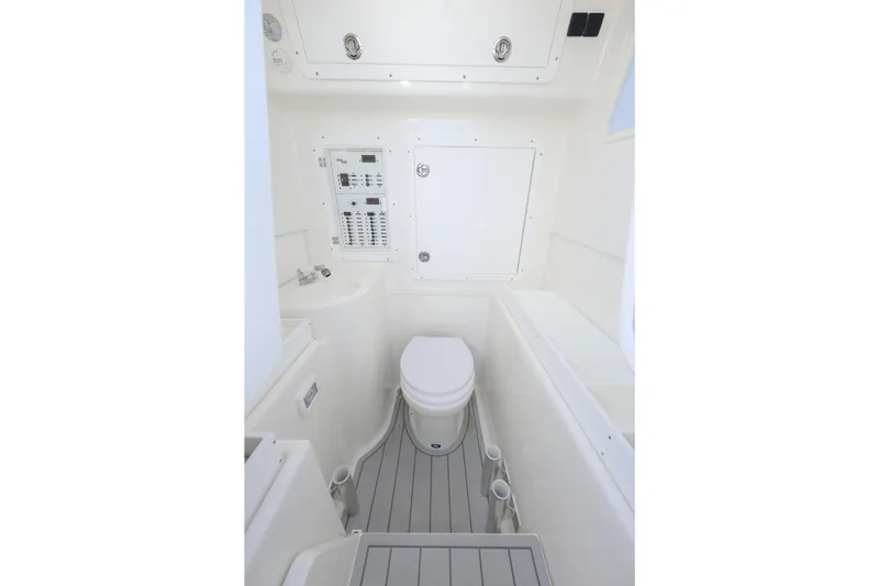  Yacht Photos Pics 2021 SeaVee 390Z boat interior bathroom with toilet and control panel.