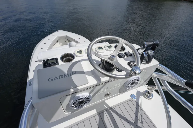 Yacht Photos Pics 2021 SeaVee 390Z boat helm with Garmin navigation system on calm water.