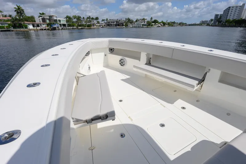  Yacht Photos Pics 2021 SeaVee 390Z boat deck with seating, cruising on a scenic waterway.