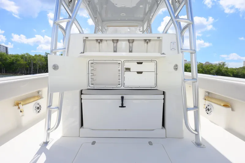  Yacht Photos Pics 2021 SeaVee 390Z boat interior with storage compartments and ladder, under a clear blue sky.