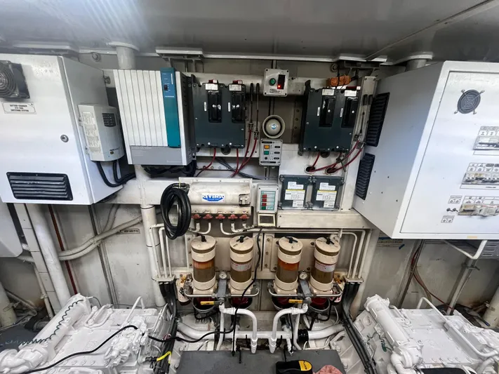  Yacht Photos Pics Engine room of a 2000 Rizzardi 75 yacht, showcasing electrical panels and machinery.