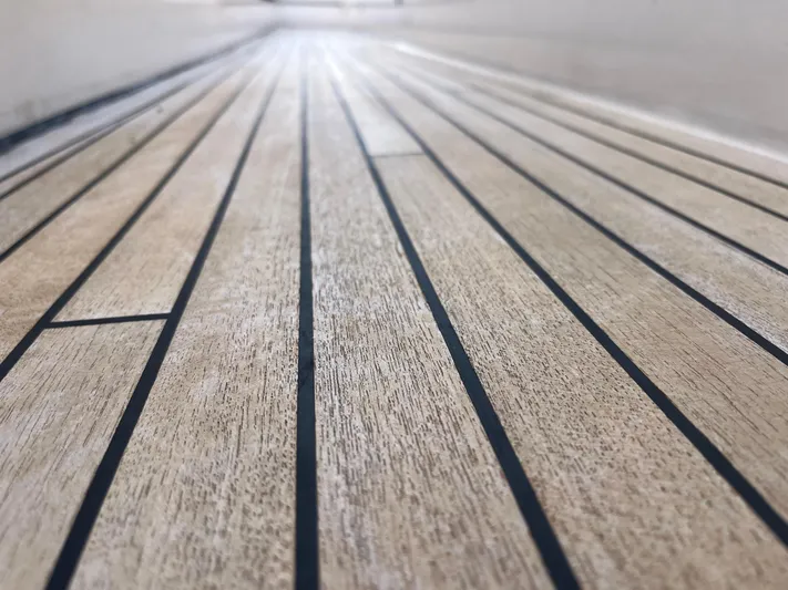  Yacht Photos Pics Teak deck of a 2000 Rizzardi 75 yacht, showcasing elegant wood grain and craftsmanship.