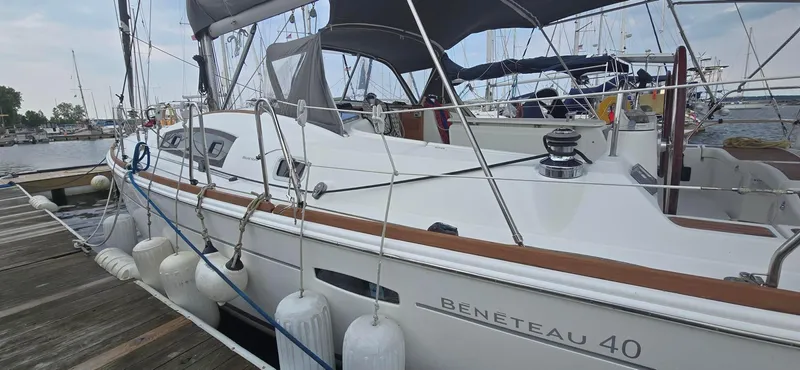 Farenheight Yacht Photos Pics 2008 Beneteau Oceanis 40 sailboat docked at marina, side view.