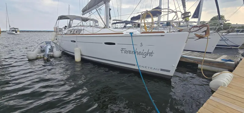 Farenheight Yacht Photos Pics Beneteau Oceanis 40 sailboat docked, 2008 model, named "Farenheight," with inflatable dinghy alongside.