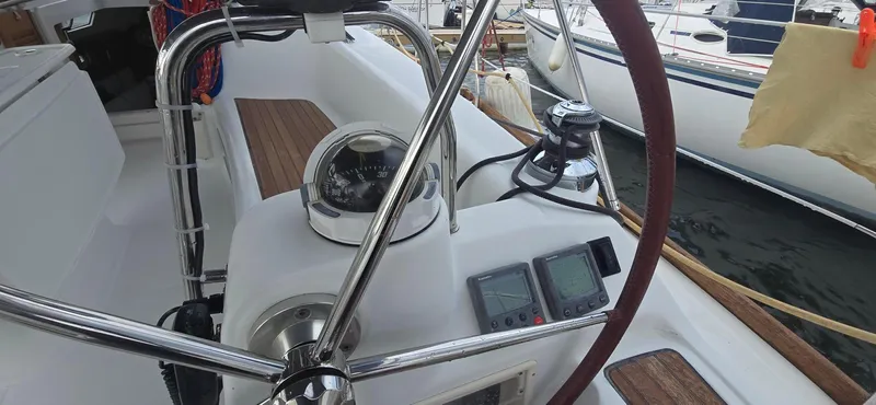 Farenheight Yacht Photos Pics Cockpit of 2008 Beneteau Oceanis 40 sailboat with steering wheel and navigation instruments.