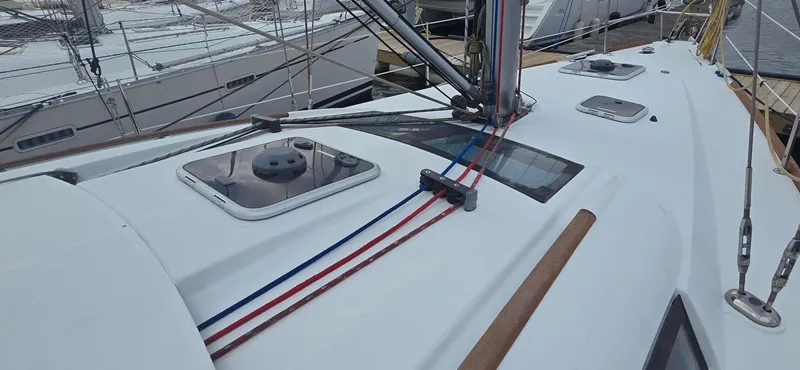 Farenheight Yacht Photos Pics 2008 Beneteau Oceanis 40 sailboat deck with hatches and rigging lines.