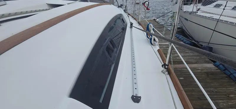 Farenheight Yacht Photos Pics Beneteau Oceanis 40 sailboat deck, 2008 model, docked beside another boat.