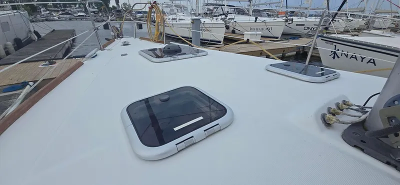 Farenheight Yacht Photos Pics Beneteau Oceanis 40 sailboat deck, 2008 model, docked at marina with other boats.