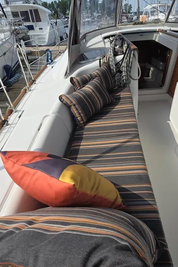 Farenheight Yacht Photos Pics Beneteau Oceanis 40 sailboat deck with striped cushions, 2008 model, docked at marina.
