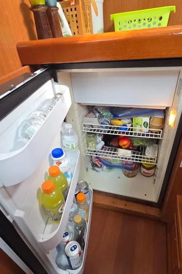 Farenheight Yacht Photos Pics Refrigerator stocked with drinks and food inside a 2008 Beneteau Oceanis 40 sailboat.