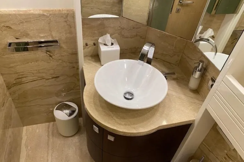  Yacht Photos Pics Luxurious bathroom on 2010 Maiora 27 yacht with elegant sink and marble finish.
