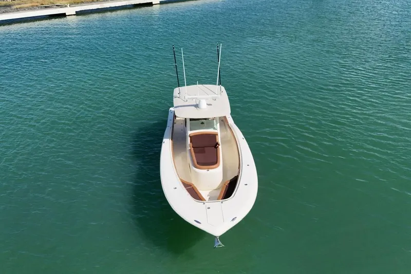  Yacht Photos Pics 2015 Scout 350 LXF boat on calm green water, aerial view.