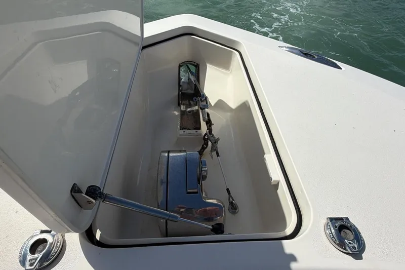  Yacht Photos Pics Open anchor compartment on 2015 Scout 350 LXF boat, showing anchor mechanism.