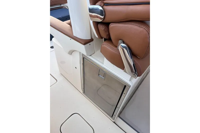  Yacht Photos Pics 2015 Scout 350 LXF boat interior with brown leather seating and stainless steel storage.
