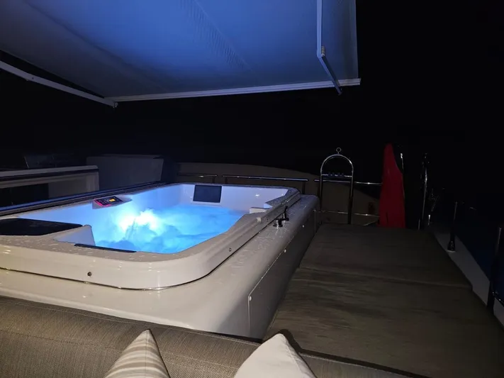 Murano Yacht Photos Pics Luxurious Azimut 72 FLY yacht with illuminated jacuzzi at night, 2018 model.