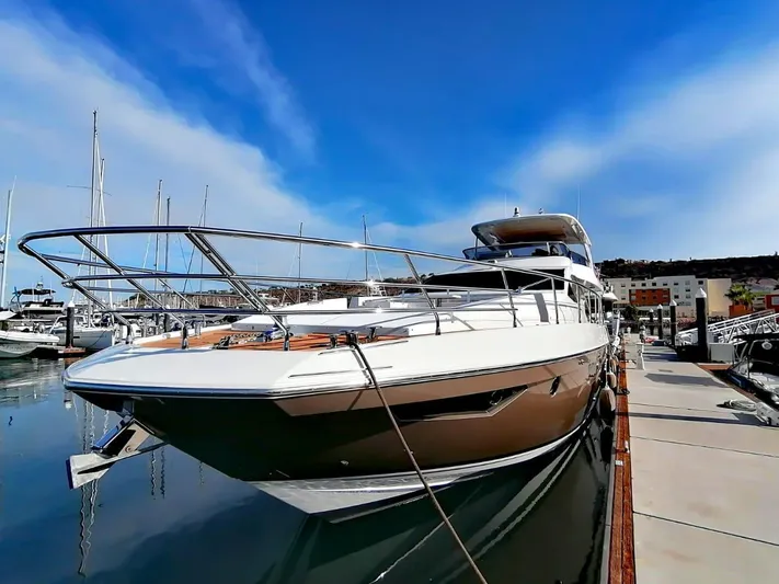 Murano Yacht Photos Pics Azimut 72 FLY 2018 yacht docked at marina under clear blue sky.