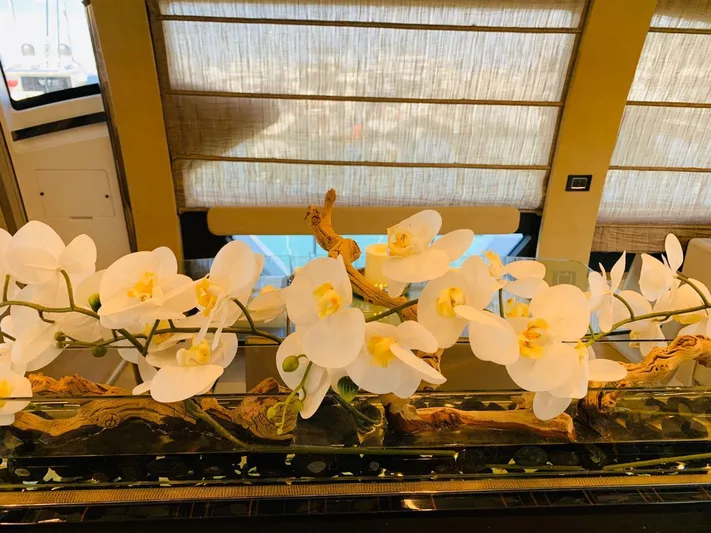 Murano Yacht Photos Pics Luxurious interior of 2018 Azimut 72 FLY yacht with elegant white orchids.