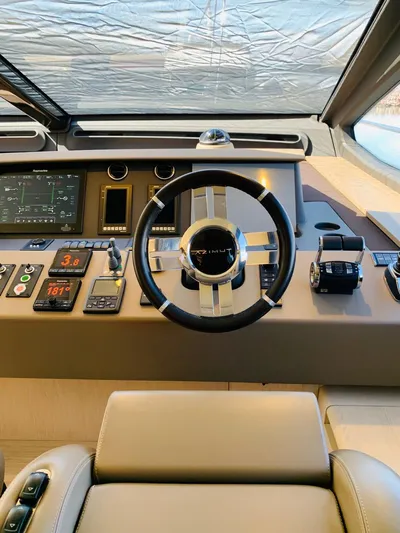 Murano Yacht Photos Pics Cockpit of 2018 Azimut 72 FLY yacht with modern controls and steering wheel.