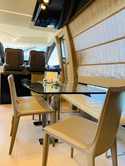 Murano Yacht Photos Pics Luxurious interior of 2018 Azimut 72 FLY yacht with elegant dining area and modern decor.