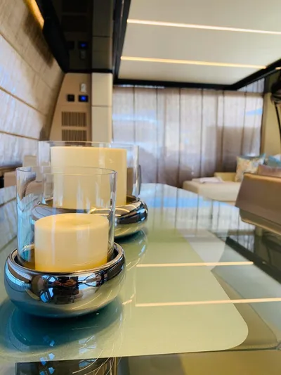 Murano Yacht Photos Pics Luxurious interior of 2018 Azimut 72 FLY yacht with elegant candle decor.