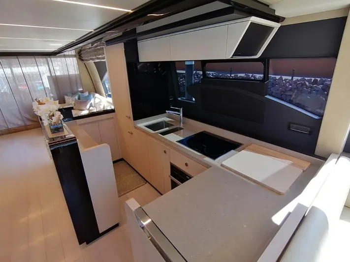 Murano Yacht Photos Pics Luxurious kitchen interior of 2018 Azimut 72 FLY yacht, featuring modern appliances and sleek design.
